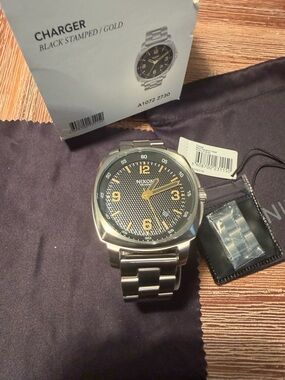 Nixon Stainless Steel Watch with Black Textured Dial and Gold Accents